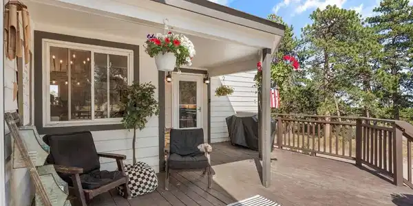 Image 3: The wraparound front porch, built for morning coffee, wildlife watching, and slow Colorado mornings. Image 3: The wraparound front porch, built for morning coffee, wildlife watching, and slow Colorado mornings.