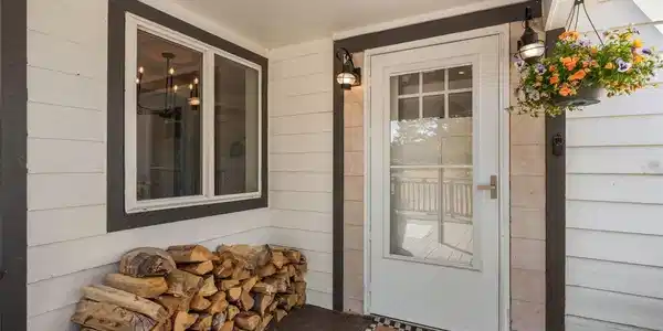 Image 4: Hanging flowers, mountain air, and a front porch that sees more elk traffic than car traffic. Image 4: Hanging flowers, mountain air, and a front porch that sees more elk traffic than car traffic.
