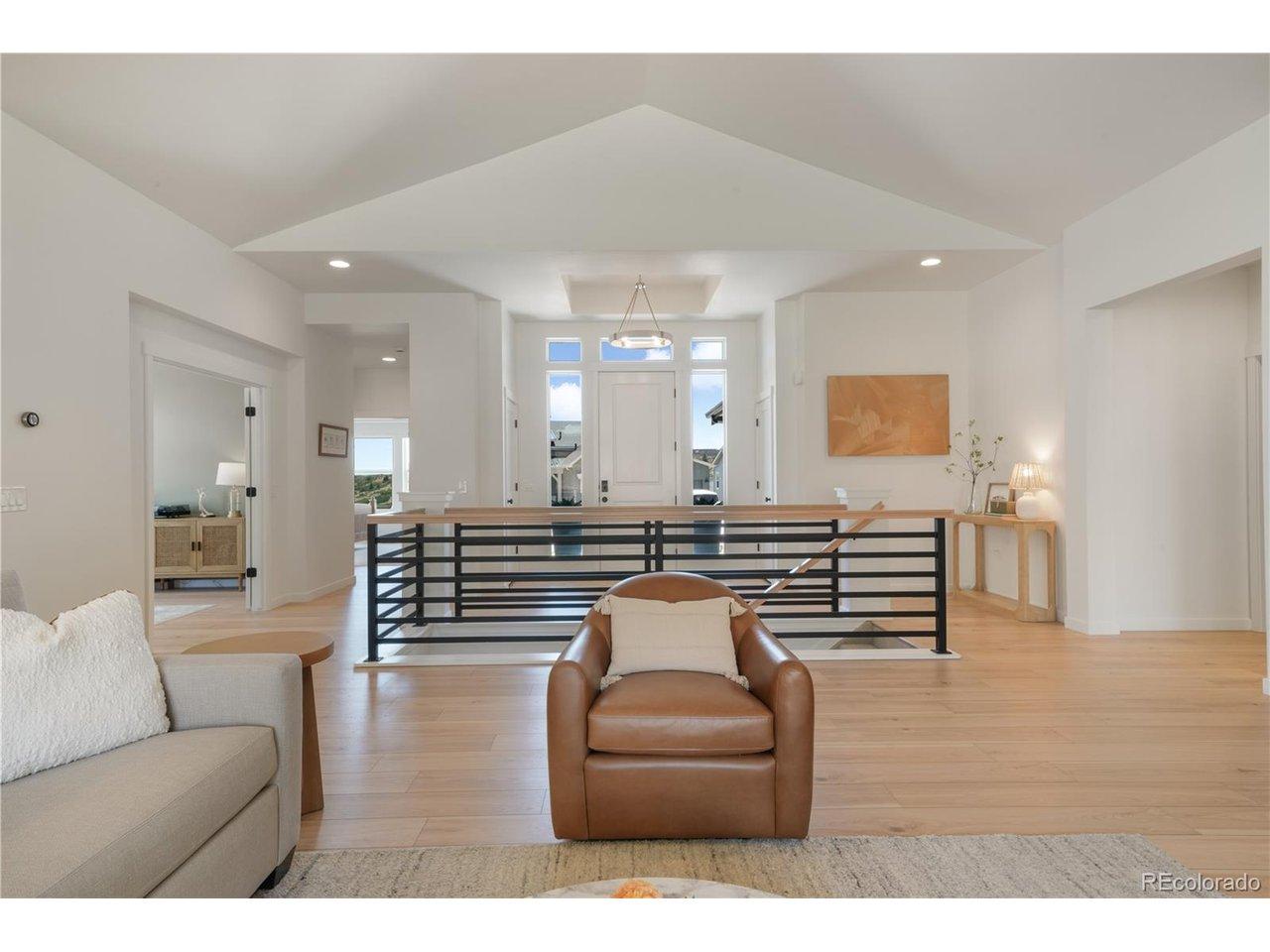 Image 4: Entry with LVP flooring and vaulted ceilings Image 4: Entry with LVP flooring and vaulted ceilings