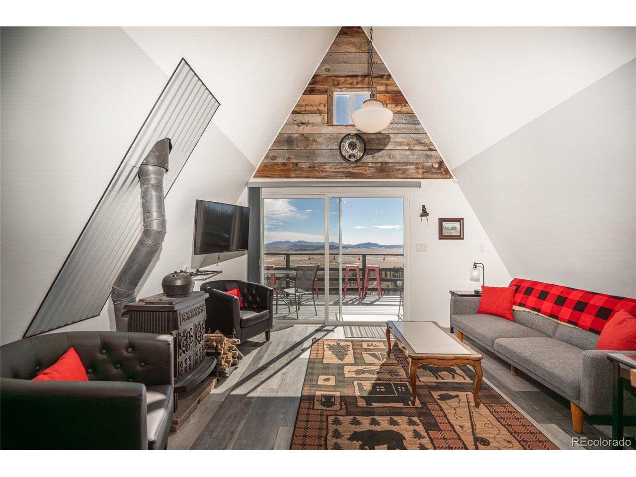 Image 4: Main level living room with reclaimed wood accents Image 4: Main level living room with reclaimed wood accents