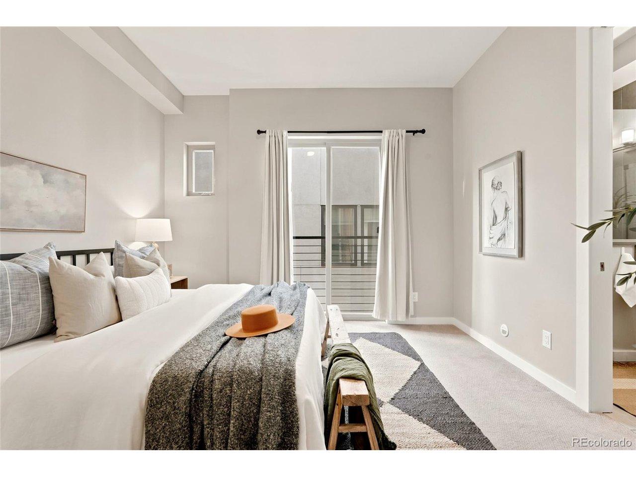 Image 4: Primary bedroom w/ ensuite bath