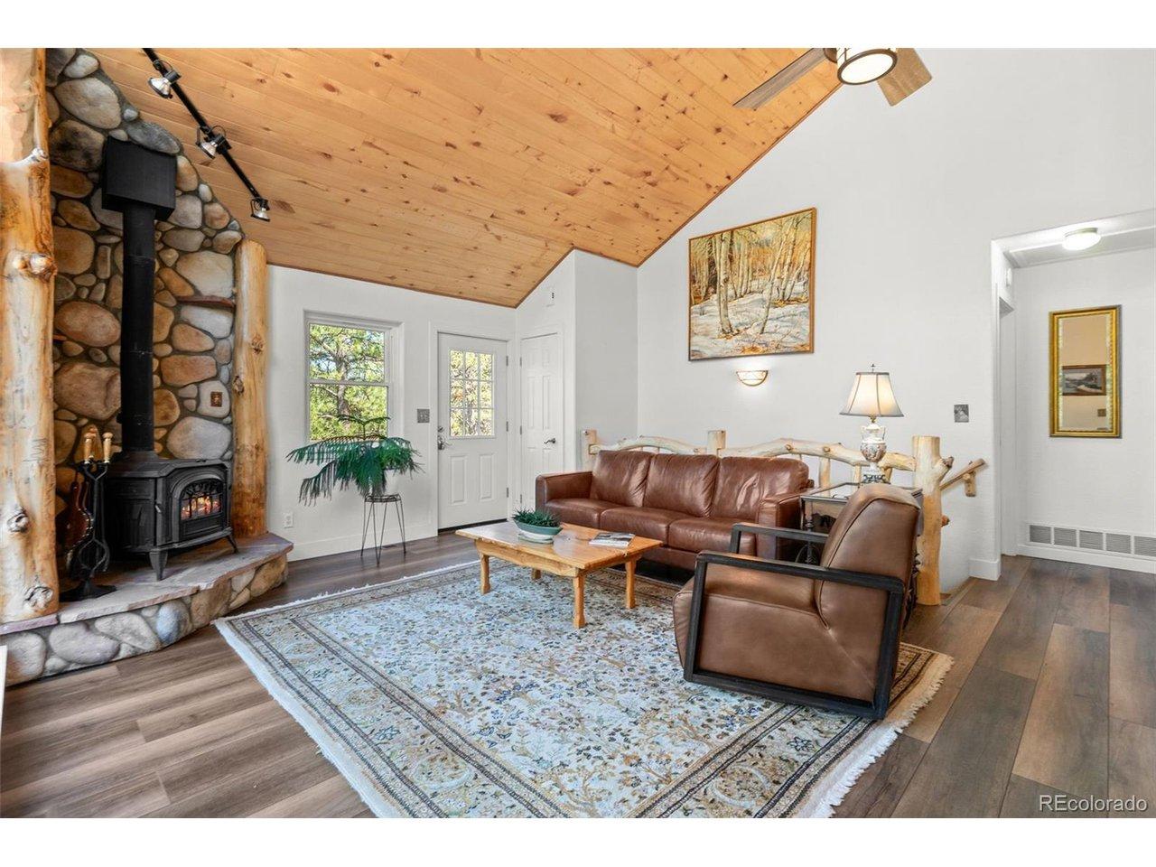 Image 4: Light-filled living room with vaulted wood ceilings Image 4: Light-filled living room with vaulted wood ceilings