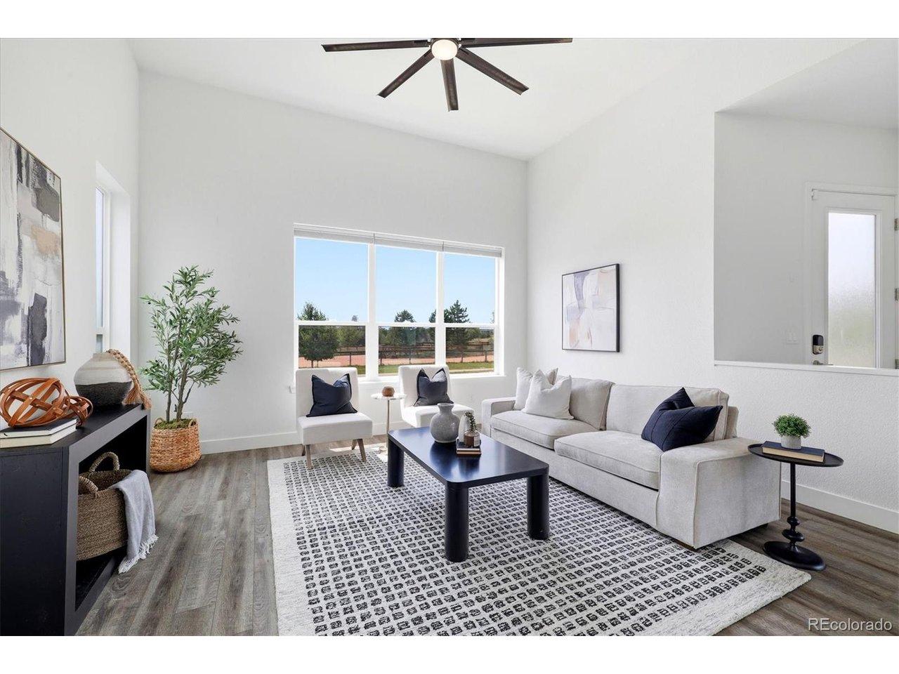 Image 3: A sun-filled entry opens to an airy living room with soaring ceilings, expansive windows with smart blinds, and clean-lined finishes. Image 3: A sun-filled entry opens to an airy living room with soaring ceilings, expansive windows with smart blinds, and clean-lined finishes.