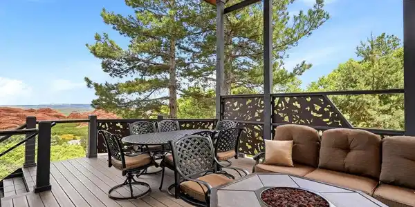 Image 4: Covered deck with La Cantina doors opening to dining and kitchen area. Image 4: Covered deck with La Cantina doors opening to dining and kitchen area.