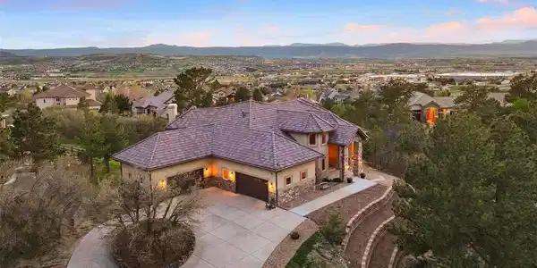 Image 3: Elevated above the surrounding rooftops, the home captures Front Range views while remaining quietly tucked into its setting.