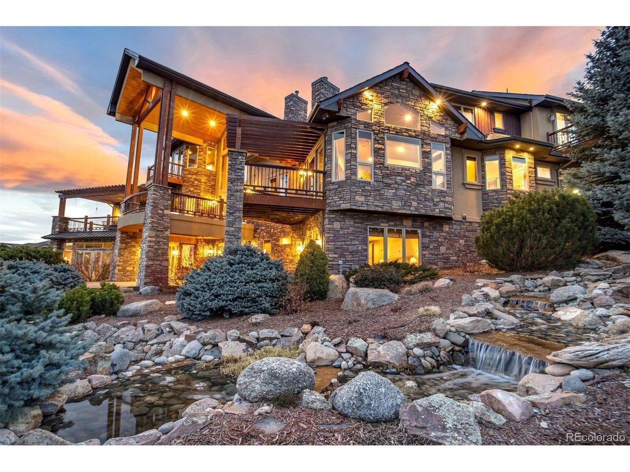 Image 1: Come on in to this grand Colorado lodge set high above the fairways of King's Deer, where stone, timber, and wide open skies come together on 2.52 private acres