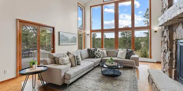 Image 3: Living room with wall of windows & vaulted ceilings Image 3: Living room with wall of windows & vaulted ceilings