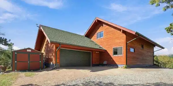 Image 3: Oversized attached 2 car garage with workspace and shed for storage Image 3: Oversized attached 2 car garage with workspace and shed for storage