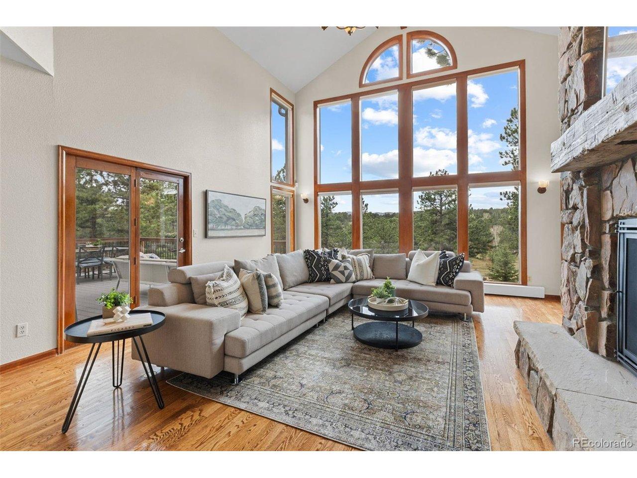 Image 1: Living room with wall of windows & vaulted ceilings Image 1: Living room with wall of windows & vaulted ceilings