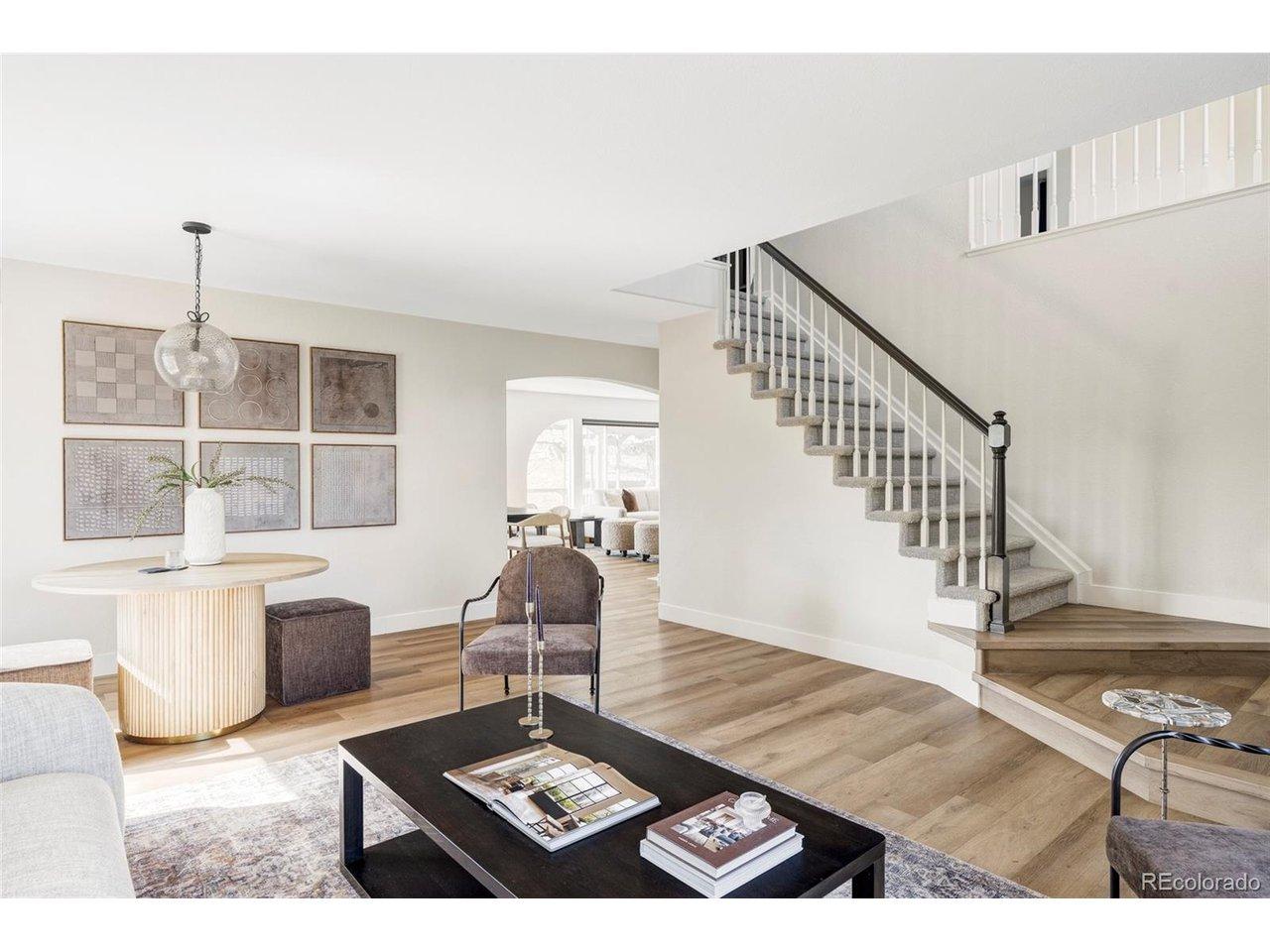 Image 4: Living room and additional dining room/ bonus room located off of the entry way. Image 4: Living room and additional dining room/ bonus room located off of the entry way.