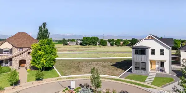 Image 3: Tucked gracefully among stunning custom homes in a quiet cul-de-sac, this lot offers an exceptional opportunity to build your dream home in a serene, highly sought-after setting.