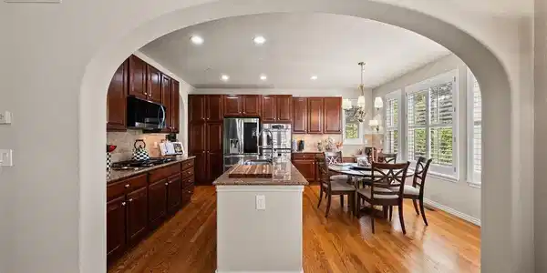 Image 4: The kitchen's large center island opens to a sunlit breakfast nook with direct access to the back deck. Image 4: The kitchen's large center island opens to a sunlit breakfast nook with direct access to the back deck.
