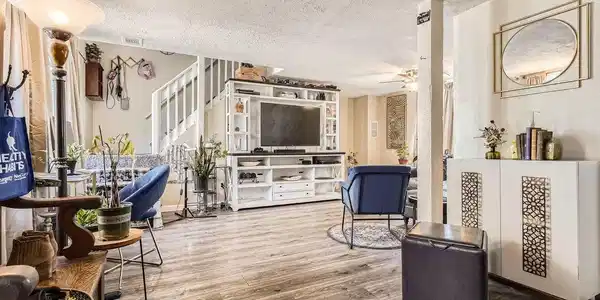 Image 4: Cheery and bright open-concept living area with expansive windows. Image 4: Cheery and bright open-concept living area with expansive windows.