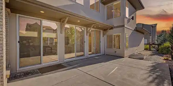 Image 2: Preview of the backyard extend patio with a wall of glass patio door perfect for entertaining Image 2: Preview of the backyard extend patio with a wall of glass patio door perfect for entertaining