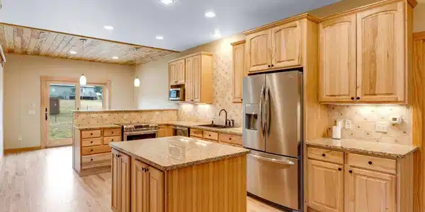 Image 2: Warm and inviting chef's kitchen complete with induction oven and granite counter tops. Image 2: Warm and inviting chef's kitchen complete with induction oven and granite counter tops.