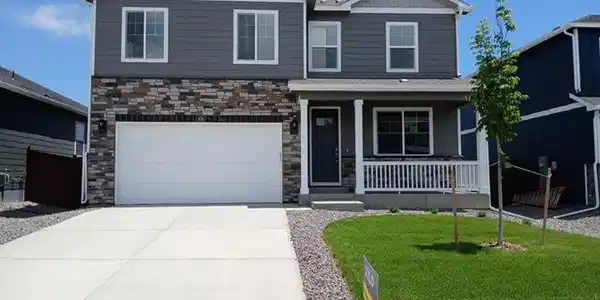 Image 3: Front of the home showing the covered front porch and 2 car garage. Image 3: Front of the home showing the covered front porch and 2 car garage.