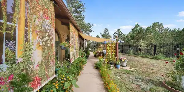Image 3: Perennials and welcoming front entry