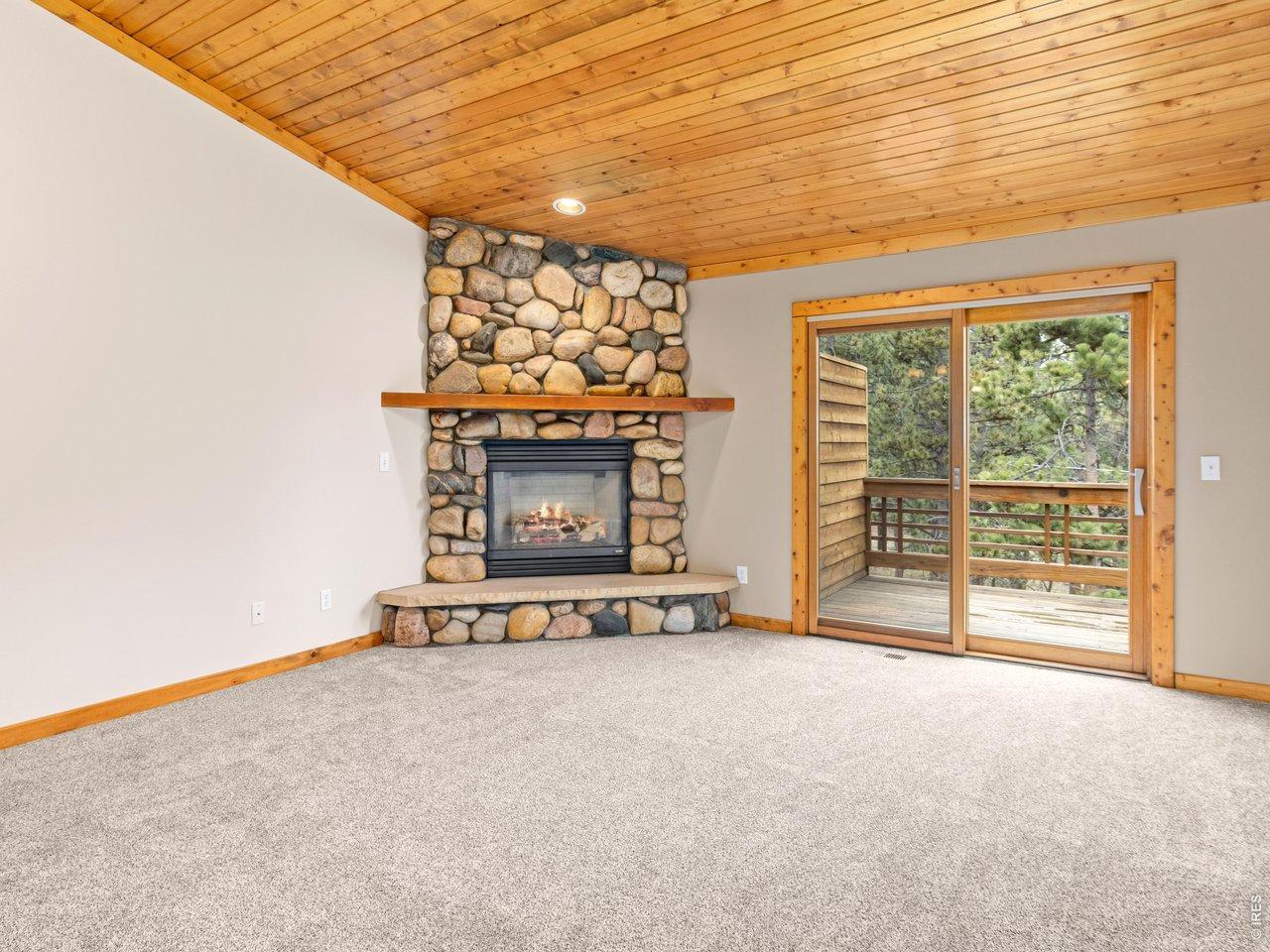 Image 2: Large Living Room with Real River Rock Fireplace