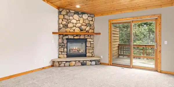 Image 2: Large Living Room with Real River Rock Fireplace