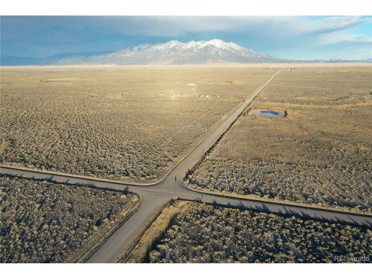 Image 2: Big view looking East towards Mount Blanca. Crossroads CR 4 S runs east and west. And CR 116 South runs north and south 116 S runs North and South.