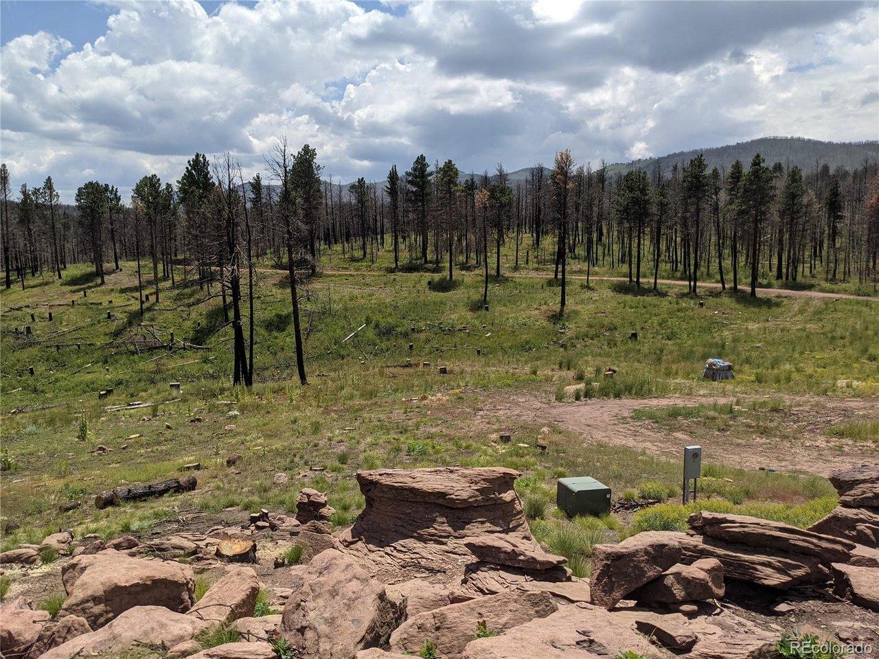Image 4: View from the rock outcropping. One of two electrical boxes and electric pedestal. Image 4: View from the rock outcropping. One of two electrical boxes and electric pedestal.