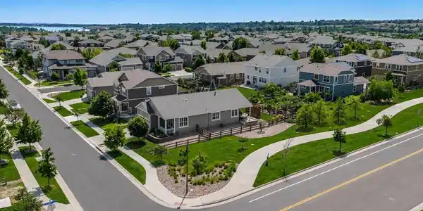 Image 4: Bordering the neighborhood greenbelt, the home offers a rare feeling of space and openness, with miles of nearby trails to Standley Lake enhancing the beauty of everyday life.