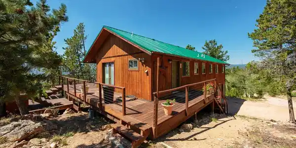 Image 3: Wrap around deck-shows entry door and dining room double doors Image 3: Wrap around deck-shows entry door and dining room double doors