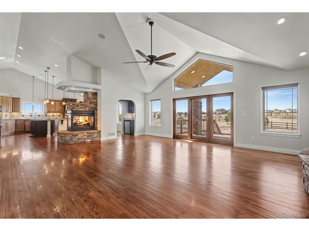 Image 4: Stunning Great Room, Vaulted Ceilings, Solid Wood Floors, Windows of Natural Light, Gas Fireplaces, Built-In Bookshelves Image 4: Stunning Great Room, Vaulted Ceilings, Solid Wood Floors, Windows of Natural Light, Gas Fireplaces, Built-In Bookshelves