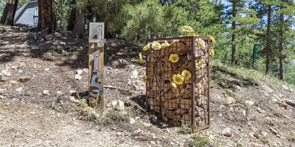 Image 2: Custom metal artwork is found throughout the property