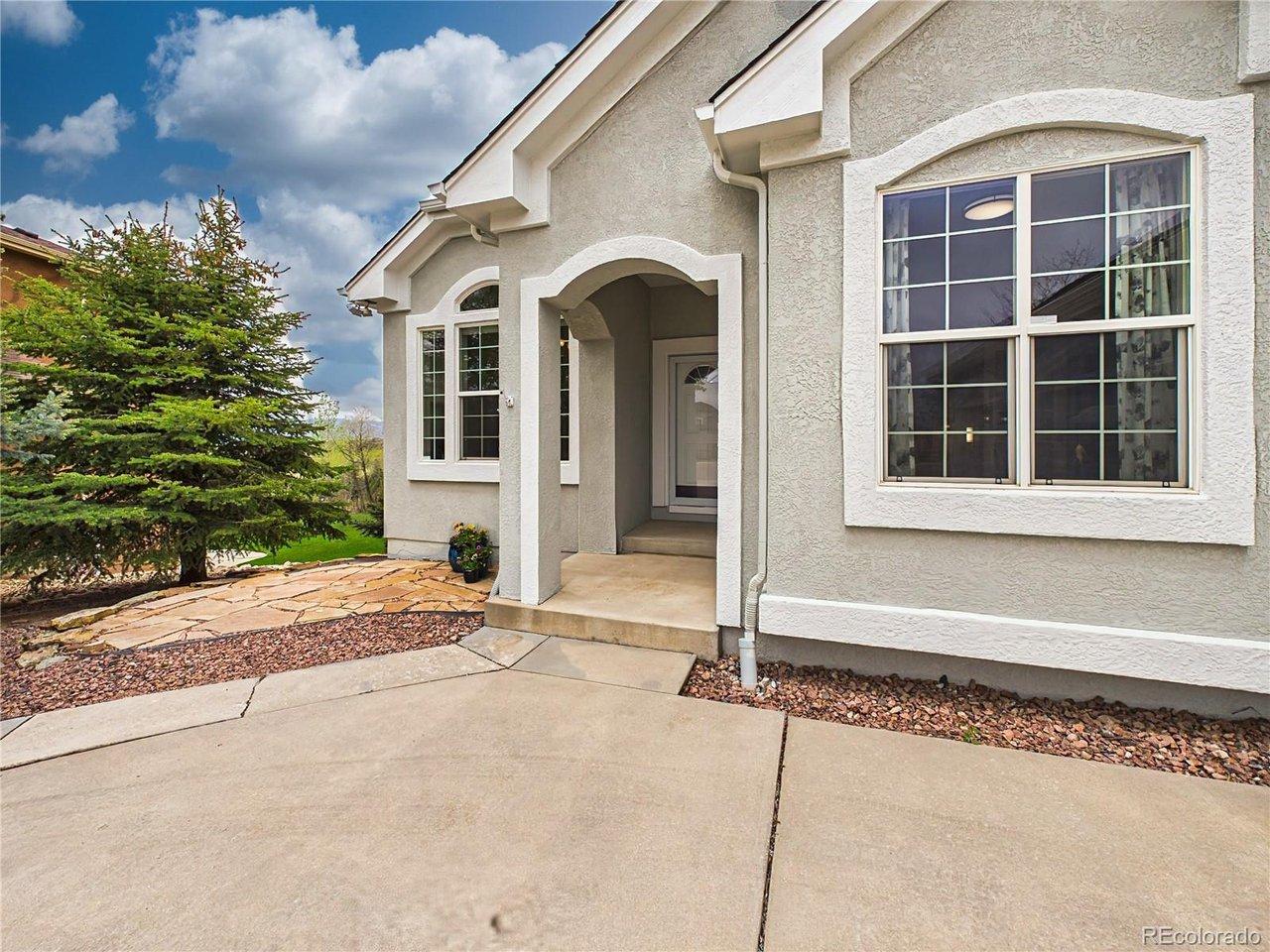 Image 2: Welcoming covered front porch featuring elegant arched architectural details, charming stone walkways, and a patio that leads to the spacious backyard. Image 2: Welcoming covered front porch featuring elegant arched architectural details, charming stone walkways, and a patio that leads to the spacious backyard.