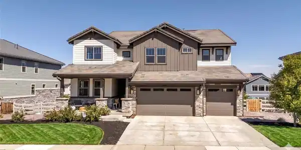 Image 2: Rare 4-car tandem garage and wide driveway (lawn enhanced)