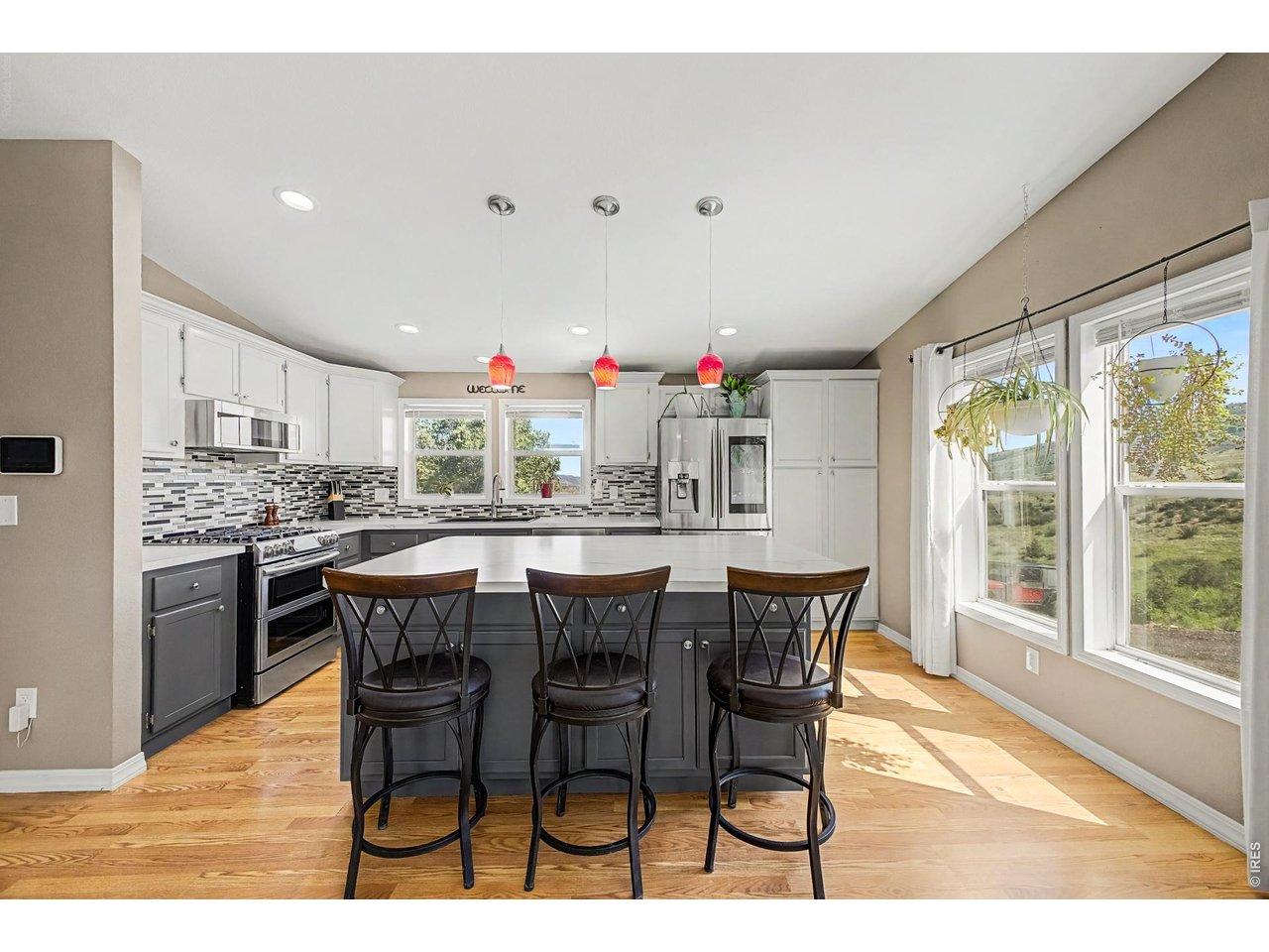 Image 4: Recently renovated kitchen includes a large kitchen island