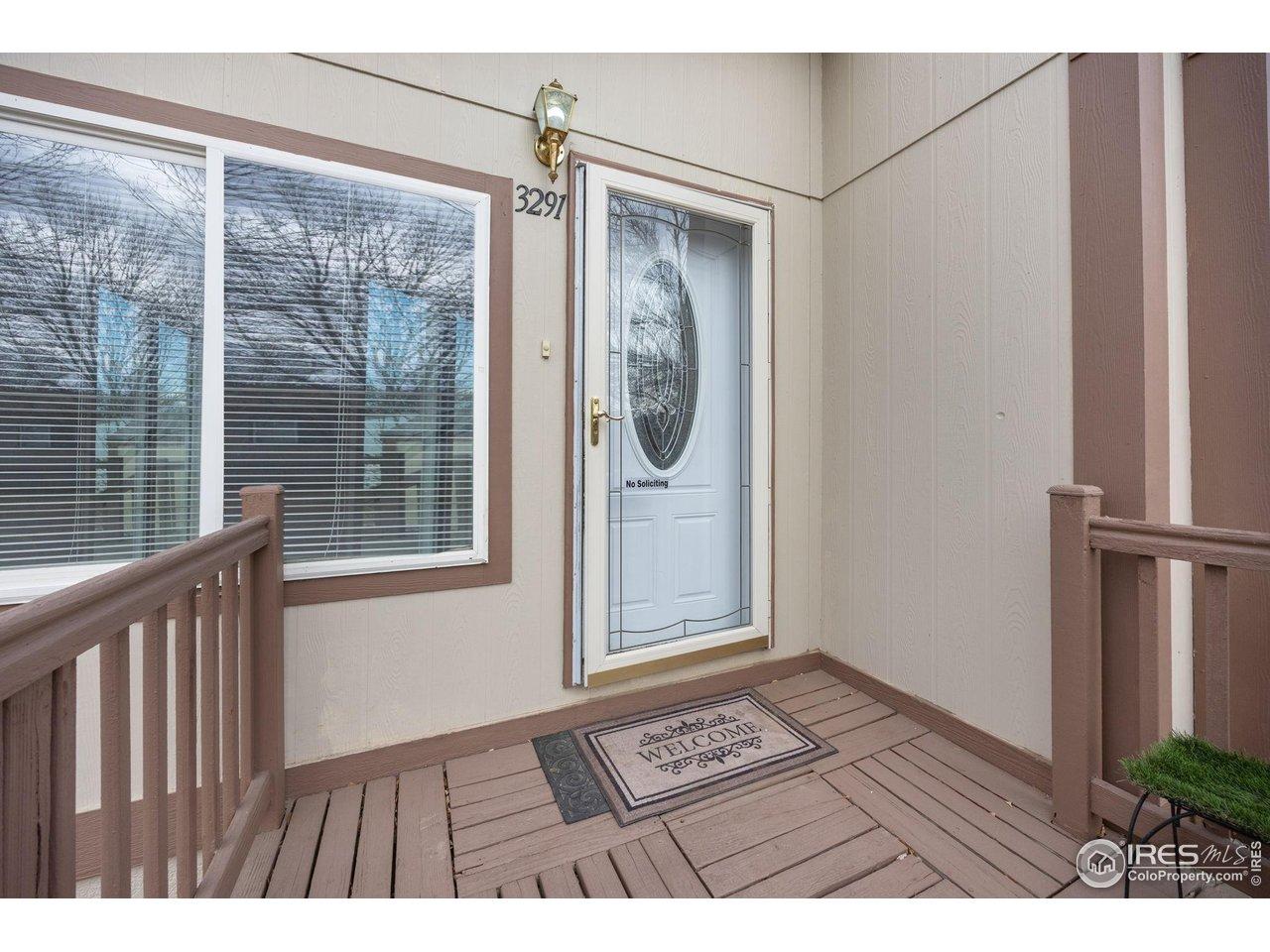 Image 3: The welcoming front porch is on the sunny south side of the house. The storm door is brand new Image 3: The welcoming front porch is on the sunny south side of the house. The storm door is brand new