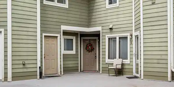 Image 4: Front door to 9-G has the wreath on the door. Image 4: Front door to 9-G has the wreath on the door.