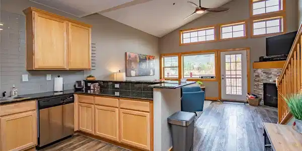 Image 4: Oversized Kitchen with Counter Bar and Stainless Steel Appliances Image 4: Oversized Kitchen with Counter Bar and Stainless Steel Appliances