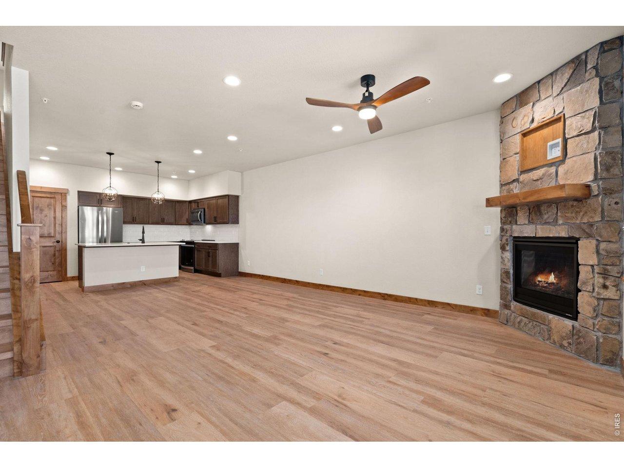 Image 2: Floor to ceiling stone gas fireplace. Image 2: Floor to ceiling stone gas fireplace.