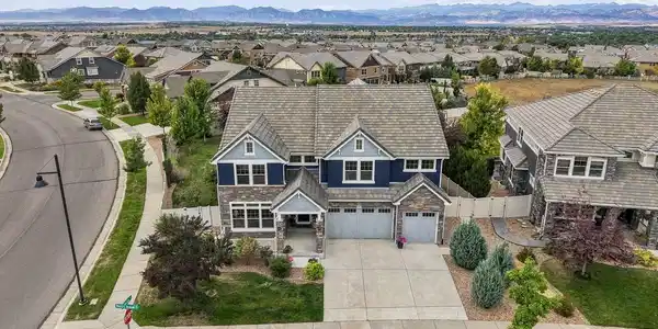 Image 2: An aerial view puts the setting in perspective - the Blue House, its spacious lot and the Front Range stretching across the horizon. Image 2: An aerial view puts the setting in perspective - the Blue House, its spacious lot and the Front Range stretching across the horizon.