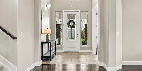 Image 4: Step inside to a bright entry with hardwood floors and an open view into the main level. Image 4: Step inside to a bright entry with hardwood floors and an open view into the main level.
