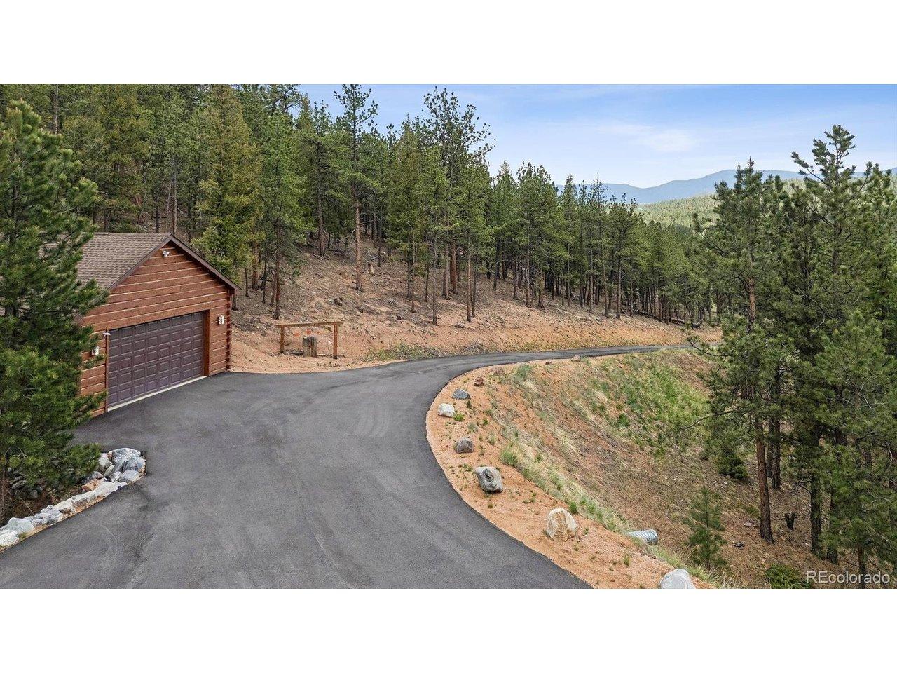 Image 2: driveway with detached garage Image 2: driveway with detached garage