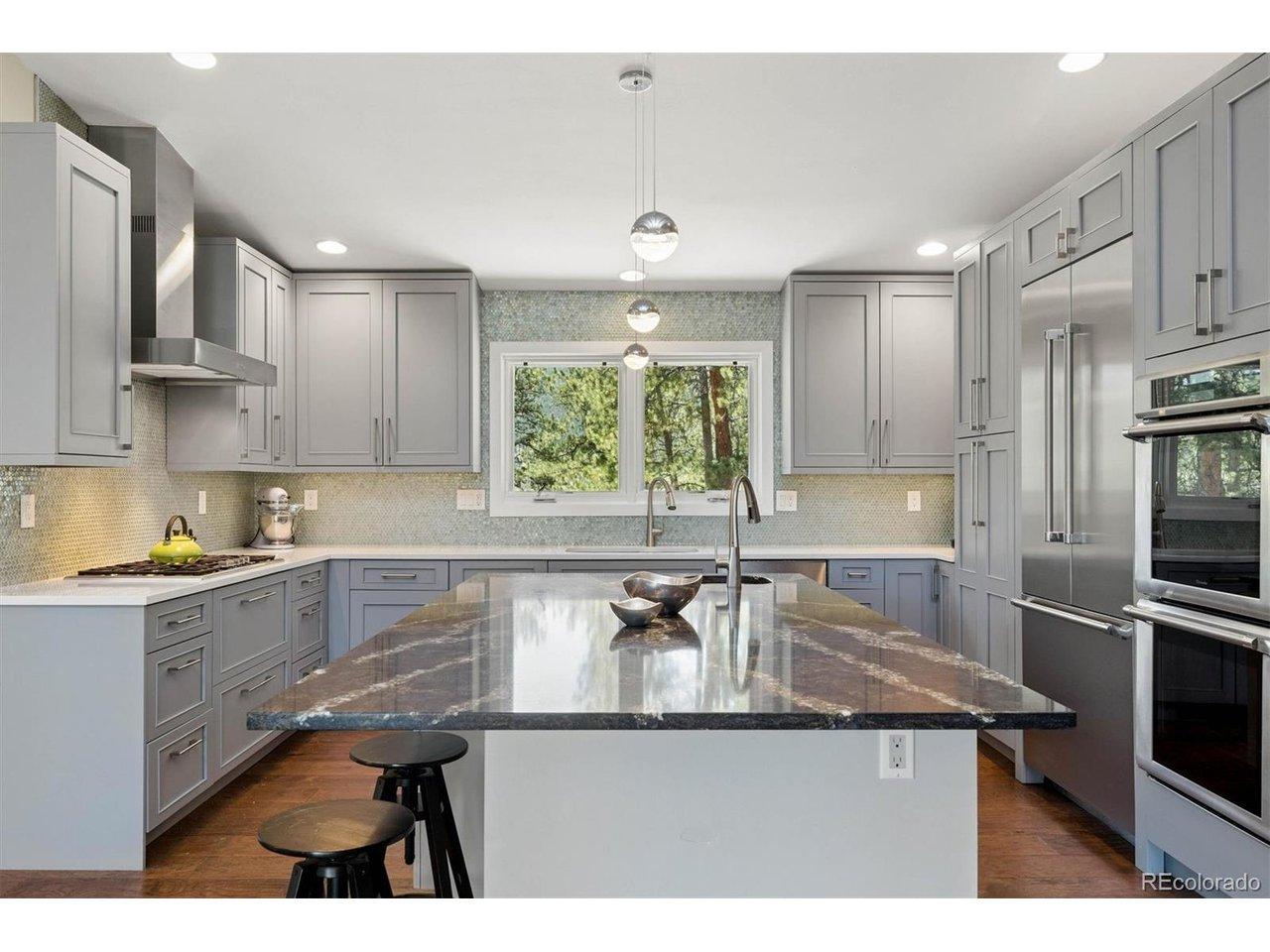 Image 3: The custom kitchen is equipped with built-in Thermador appliances and anchored by a limited-release Princetown quartz island by Cambria Image 3: The custom kitchen is equipped with built-in Thermador appliances and anchored by a limited-release Princetown quartz island by Cambria