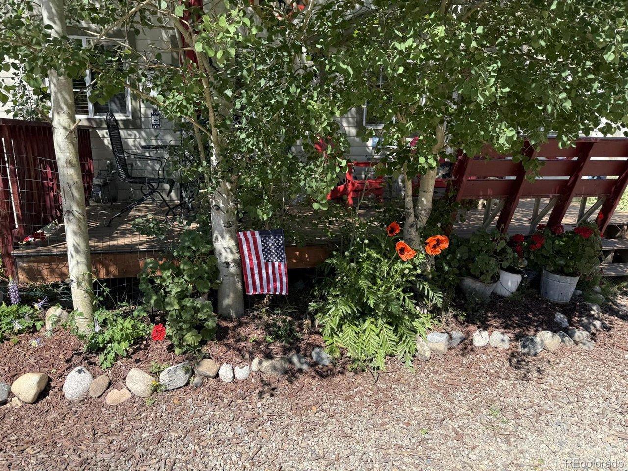 Image 3: flowers out front