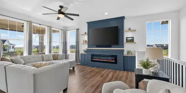 Image 3: Enjoy a wall of windows in the Living Room with custom fireplace Image 3: Enjoy a wall of windows in the Living Room with custom fireplace