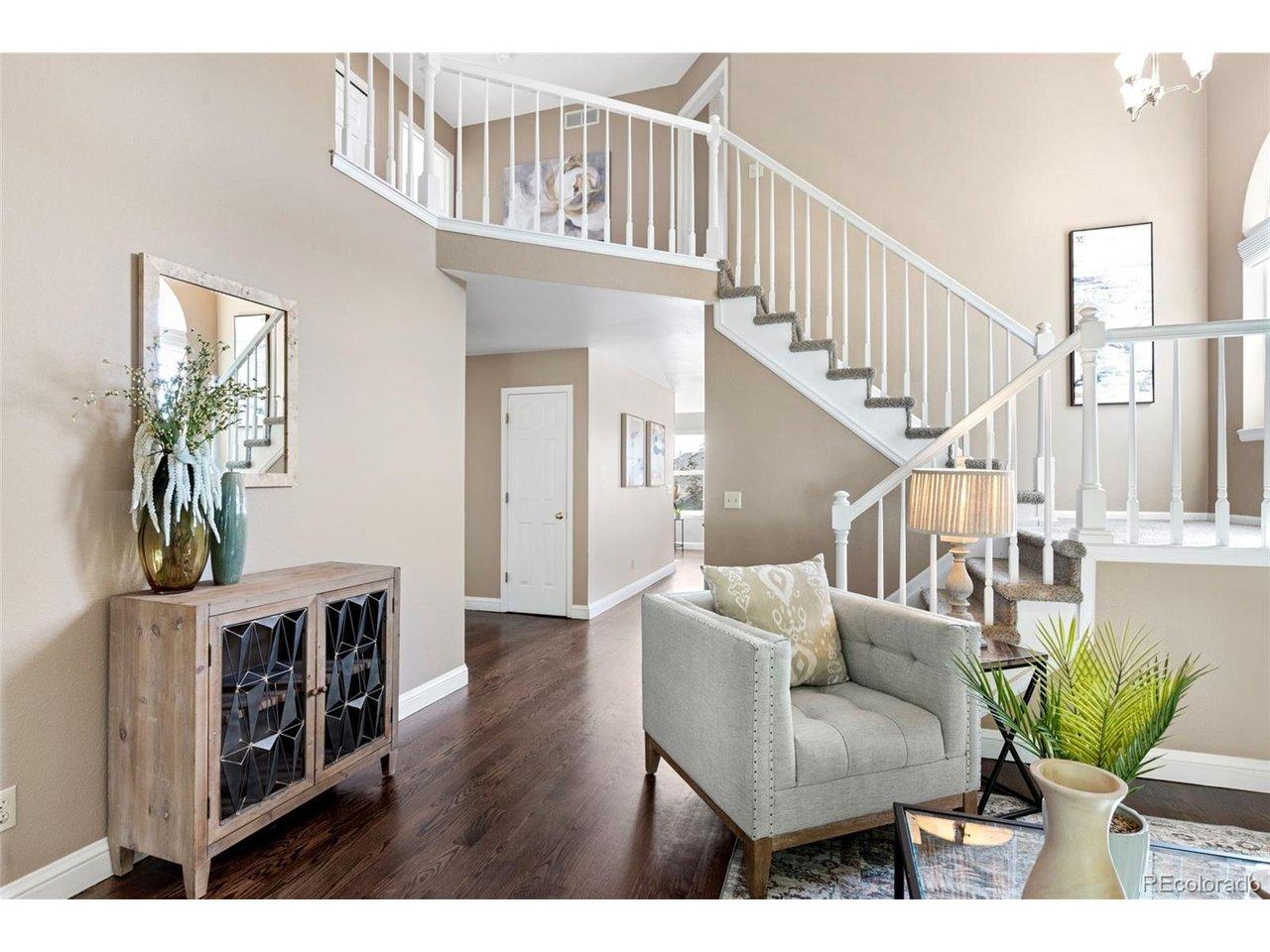Image 3: Open and airy, the space is enhanced with an earth tone plank flooring. Image 3: Open and airy, the space is enhanced with an earth tone plank flooring.