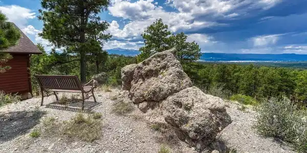 Image 2: Perched high above Colorado Springs, this exceptional custom 4BR, 3BA home offers breathtaking 360-degree views of the city skyline, majestic mountains, and iconic Pikes Peak. Image 2: Perched high above Colorado Springs, this exceptional custom 4BR, 3BA home offers breathtaking 360-degree views of the city skyline, majestic mountains, and iconic Pikes Peak.