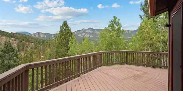Image 4: Step out onto the wraparound deck and the mountains simply open up before you - layer upon layer of pine forest giving way to rugged rock formations against an endless Colorado sky. This is your front-row seat to nature's best show, morning coffee in hand, Image 4: Step out onto the wraparound deck and the mountains simply open up before you - layer upon layer of pine forest giving way to rugged rock formations against an endless Colorado sky. This is your front-row seat to nature's best show, morning coffee in hand,