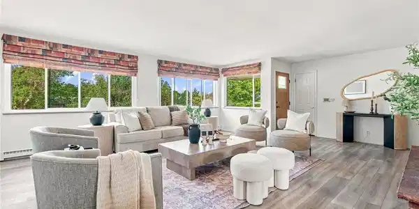 Image 4: The living room is BIG, bright and wrapped in windows with leafy views in nearly every direction. Image 4: The living room is BIG, bright and wrapped in windows with leafy views in nearly every direction.