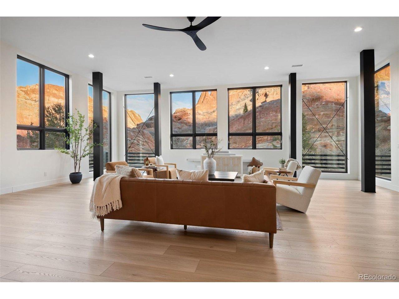 Image 1: Large Central Living Room with views overlooking the red rocks.