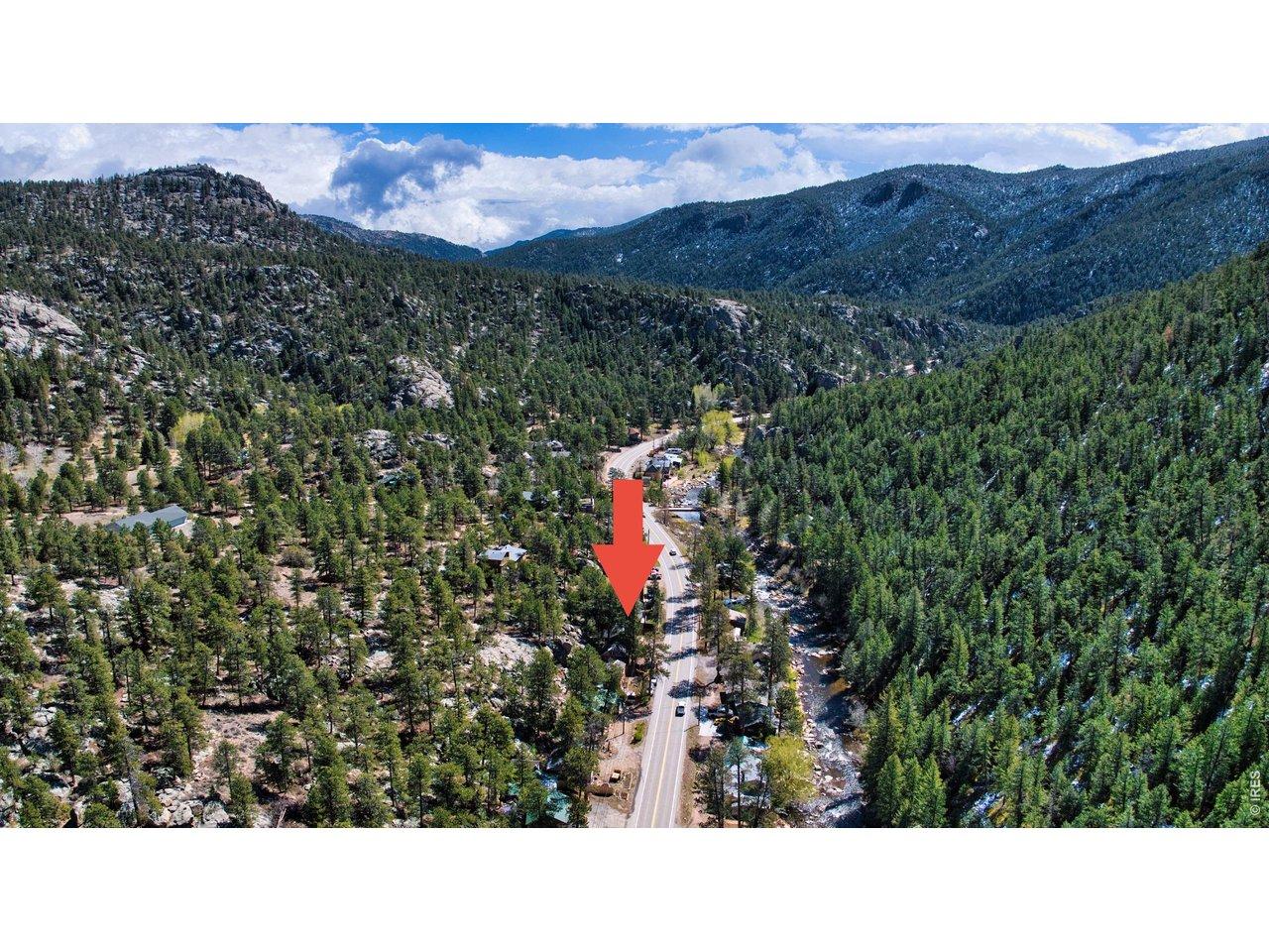 Image 2: Aerial view showcasing the home's proximity to the Big Thompson River and the natural beauty of the canyon. Image 2: Aerial view showcasing the home's proximity to the Big Thompson River and the natural beauty of the canyon.