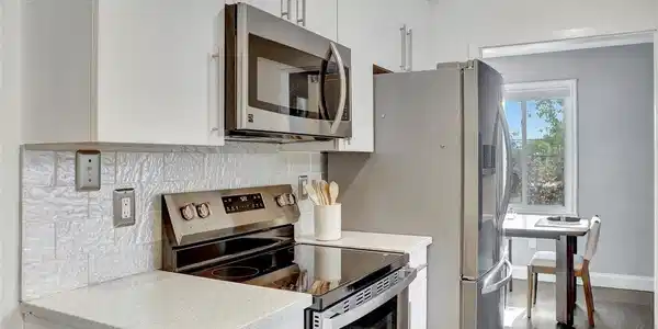 Image 3: Well-designed kitchen with sleek finishes, stainless appliances, and an efficient layout for everyday cooking.