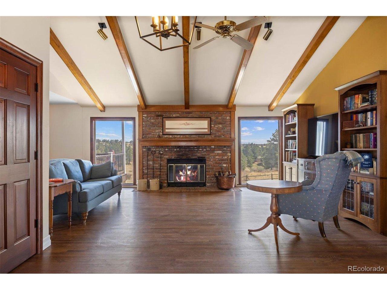 Image 4: The great room greets you with picture windows that frame the landscape and 11.5ft vaulted ceilings. Image 4: The great room greets you with picture windows that frame the landscape and 11.5ft vaulted ceilings.